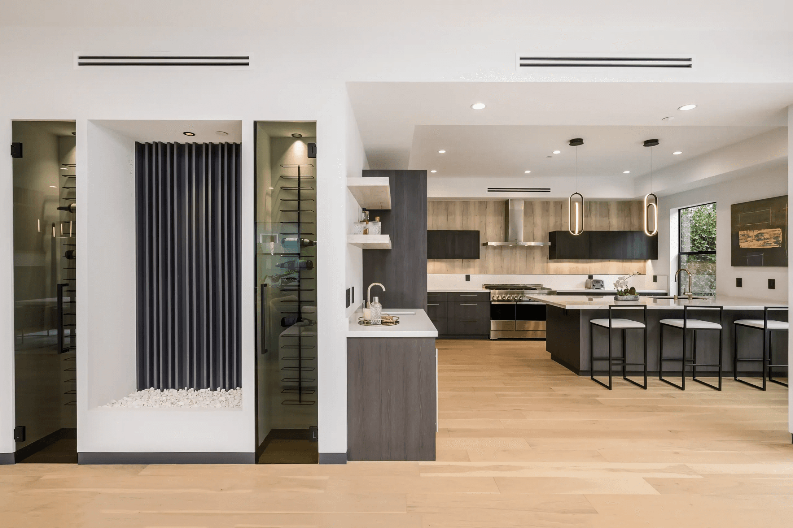 Modern luxury kitchen with custom walnut island and pendant lighting