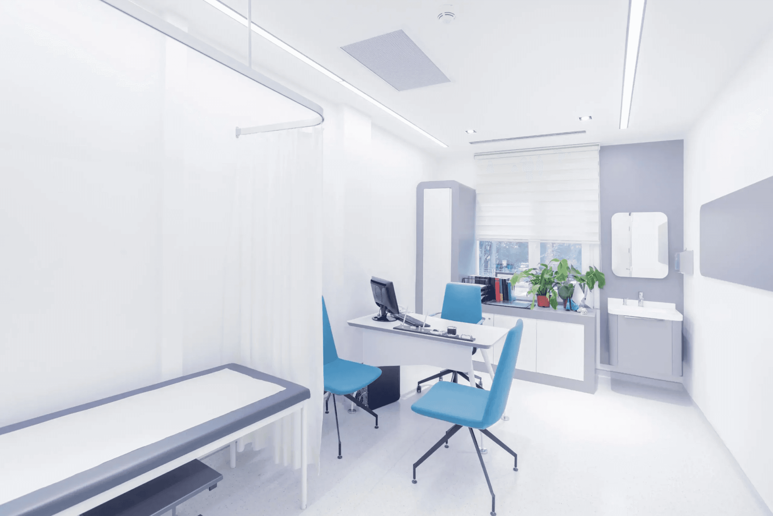 Treatment room with bespoke cabinetry and hygienic stone counters