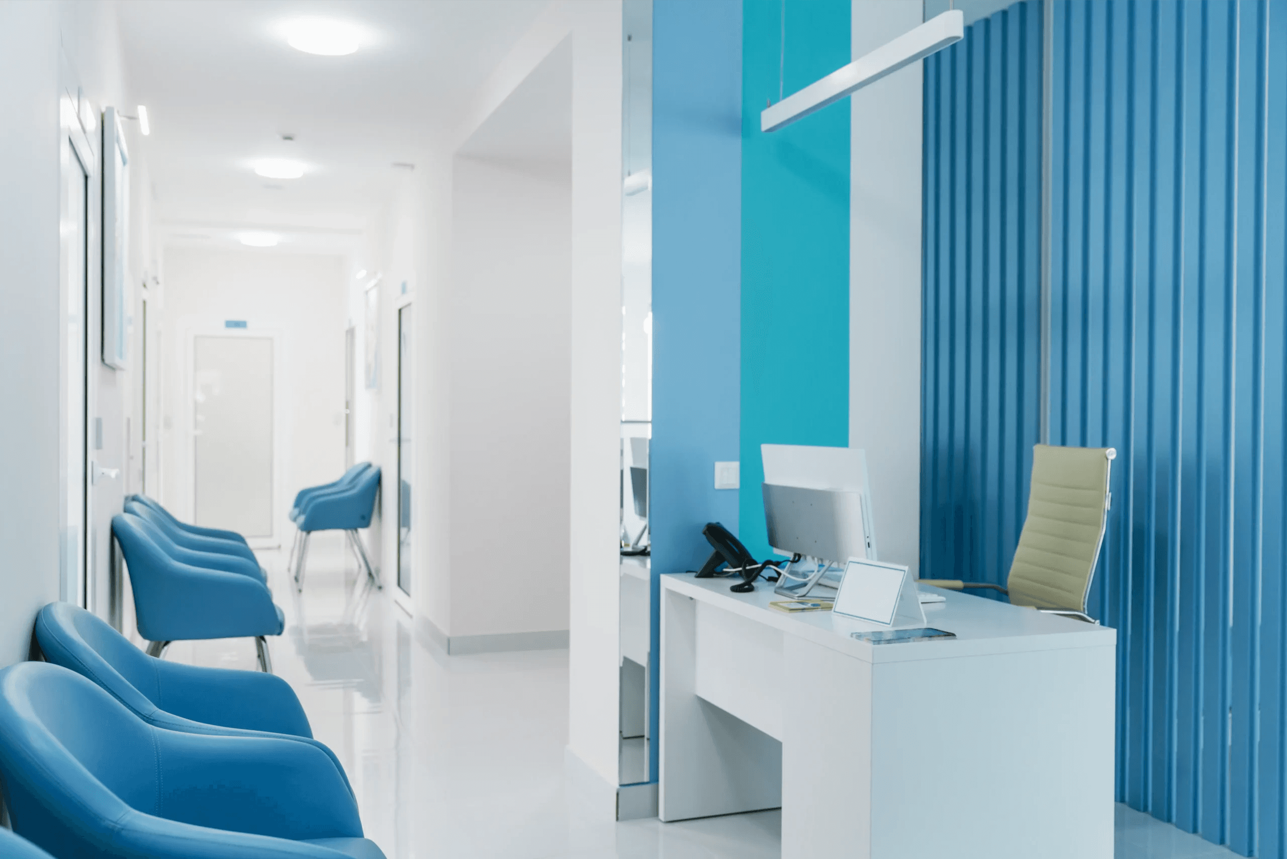 State-of-the-art medical clinic examination suite with seamless cabinetry