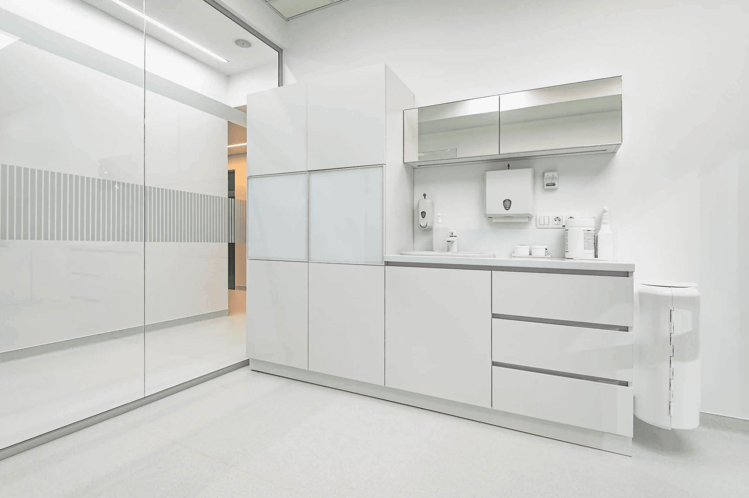 Medical exam room with antimicrobial casework and LED clinical lighting