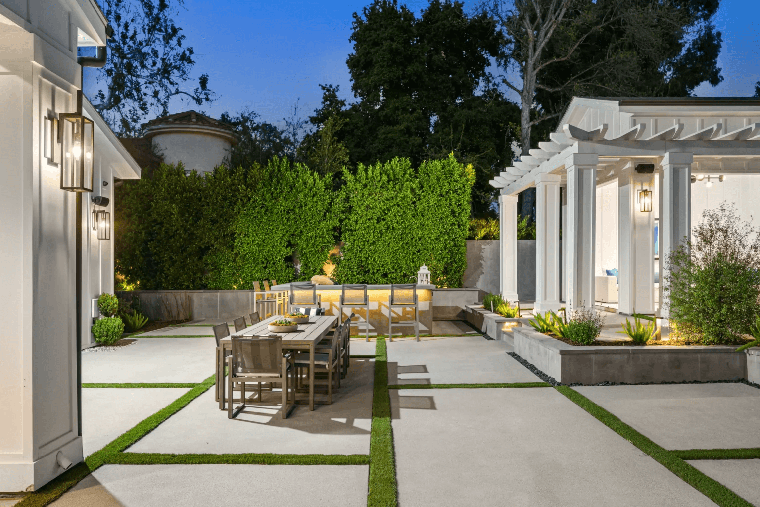 Covered outdoor patio with comfortable sectional and outdoor fireplace