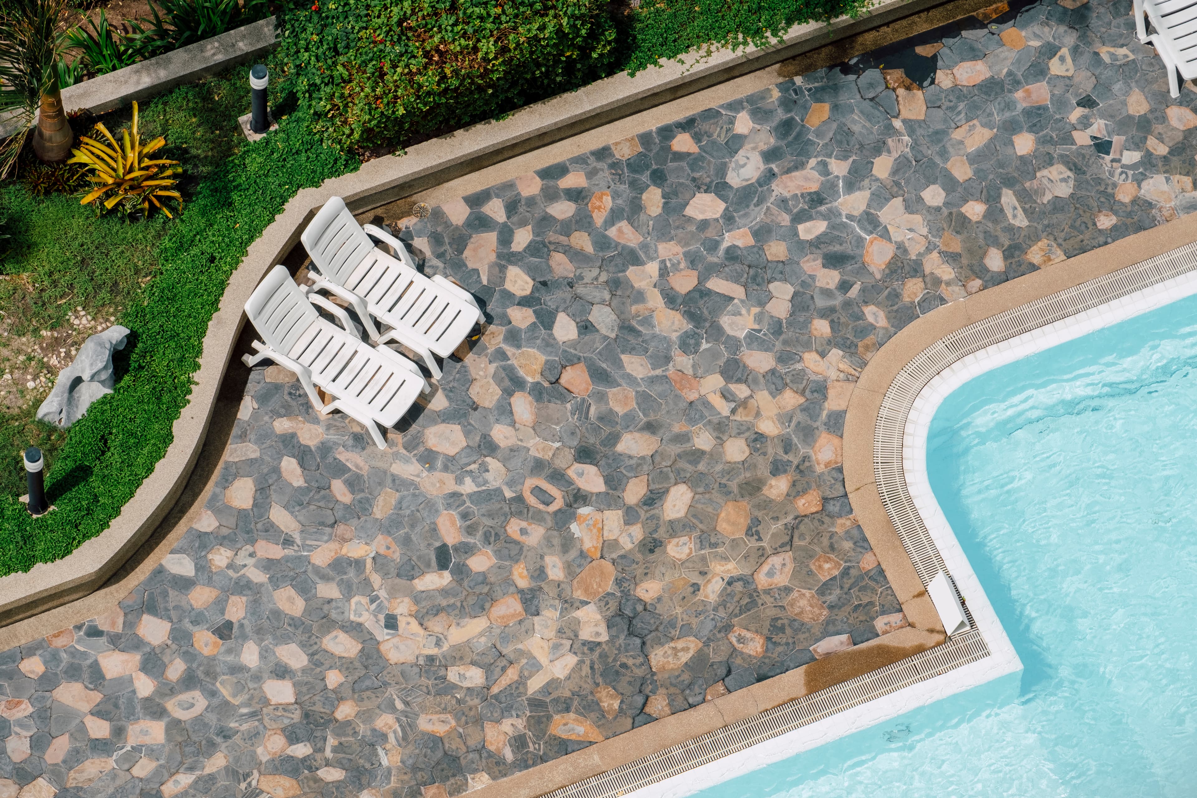 Custom paver driveway with decorative borders and contrasting inlays